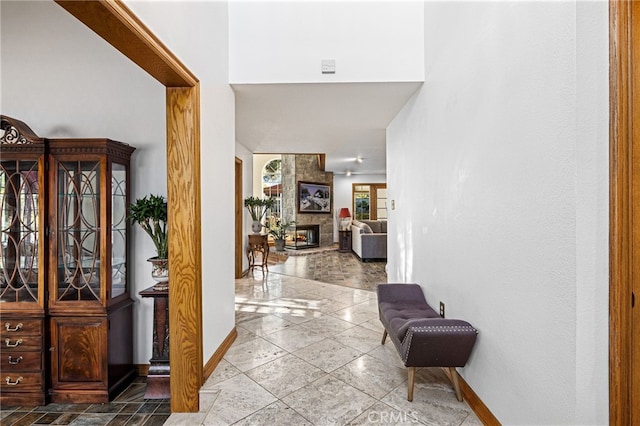 981 Deep Springs Dr, Claremont, CA 91711 - corridor featuring baseboards and stone tile floors