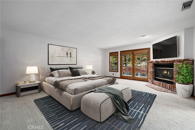 981 Deep Springs Dr, Claremont, CA 91711 - carpeted bedroom with a brick fireplace, access to outside, and a textured ceiling