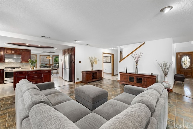 981 Deep Springs Dr, Claremont, CA 91711 - living area with a textured ceiling and stone finish floors