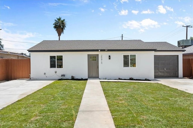 25415 Paloma Rd, San Bernardino, CA 92410 - view of front of house with stucco siding, concrete driveway, a shingled roof, and an attached garage