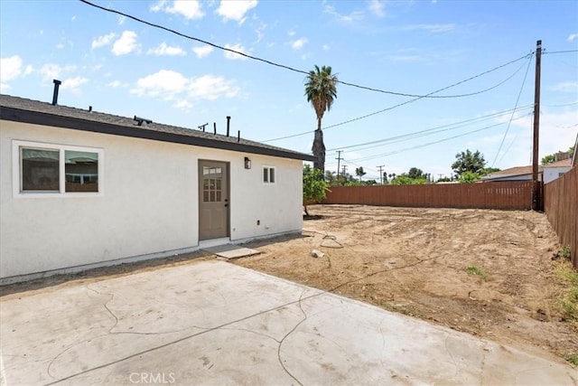 25415 Paloma Rd, San Bernardino, CA 92410 - back of house with a patio area and stucco siding