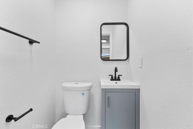 25415 Paloma Rd, San Bernardino, CA 92410 - half bathroom featuring vanity and toilet
