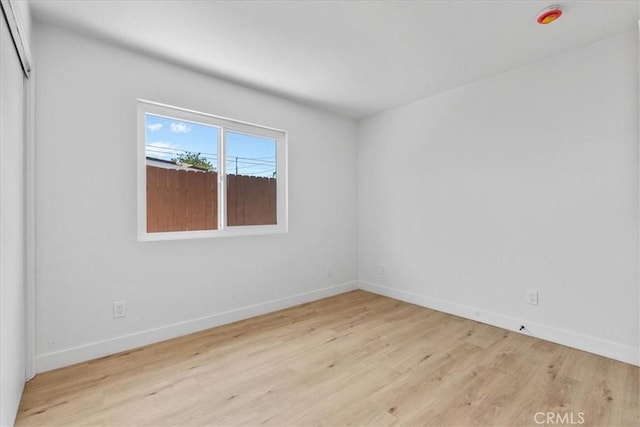 25415 Paloma Rd, San Bernardino, CA 92410 - unfurnished room with wood finished floors and baseboards