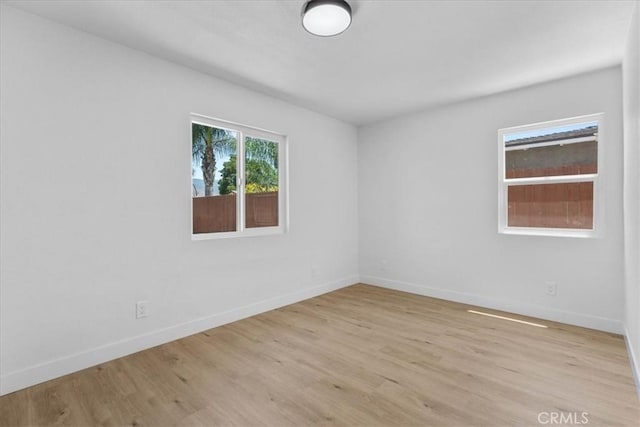 25415 Paloma Rd, San Bernardino, CA 92410 - unfurnished room featuring light wood finished floors and baseboards