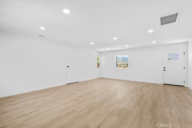 25415 Paloma Rd, San Bernardino, CA 92410 - unfurnished living room with healthy amount of natural light, recessed lighting, and light wood finished floors