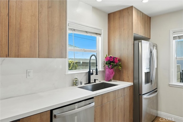 4752 Josie Ave, Lakewood, CA 90713 - kitchen featuring appliances with stainless steel finishes, plenty of natural light, light countertops, and recessed lighting