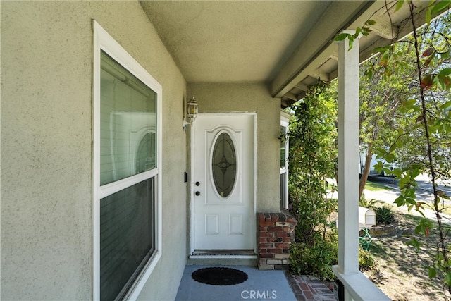 4752 Josie Ave, Lakewood, CA 90713 - view of exterior entry with stucco siding and a porch