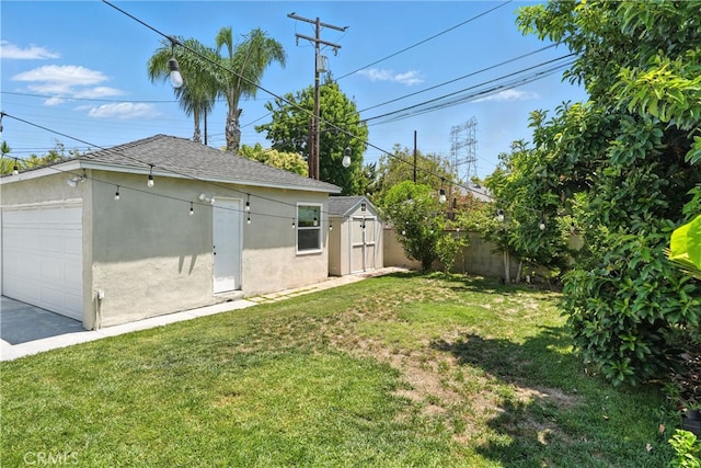 4752 Josie Ave, Lakewood, CA 90713 - view of yard featuring a garage and a storage shed
