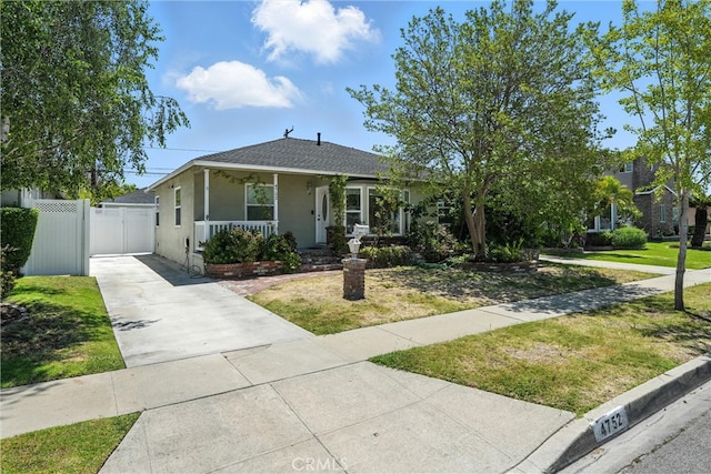 4752 Josie Ave, Lakewood, CA 90713 - bungalow-style home with concrete driveway, a porch, a gate, stucco siding, and a shingled roof