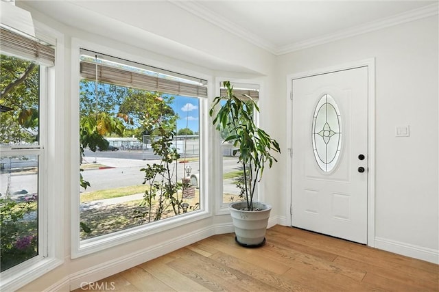 4752 Josie Ave, Lakewood, CA 90713 - foyer featuring light wood-style flooring, ornamental molding, and healthy amount of natural light