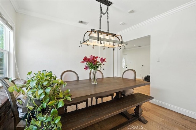 4752 Josie Ave, Lakewood, CA 90713 - dining room with ornamental molding and light wood-style flooring
