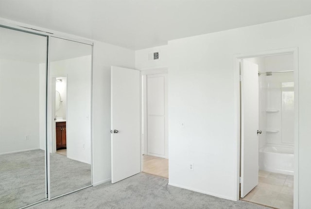 1817 E Grand Ave Unit 6, Escondido, CA 92027 - unfurnished bedroom featuring carpet flooring, a closet, and ensuite bath