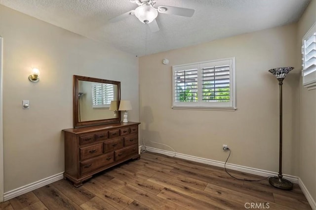 13239 Sayre St, Sylmar, CA 91342 - unfurnished bedroom featuring hardwood / wood-style flooring, a textured ceiling, and a ceiling fan