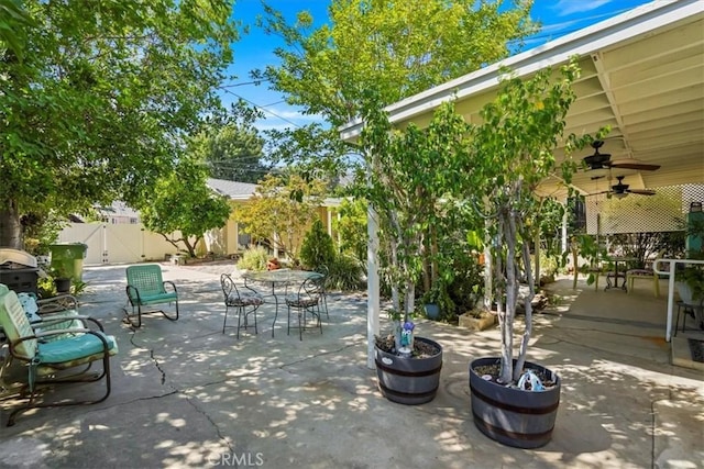 13239 Sayre St, Sylmar, CA 91342 - fenced backyard with outdoor dining area, a patio area, and a ceiling fan