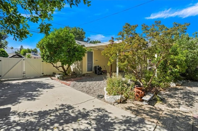 13239 Sayre St, Sylmar, CA 91342 - back of house featuring a gate and stucco siding