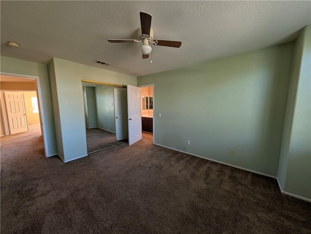 31864 Corte Montecito, Temecula, CA 92592 - unfurnished bedroom featuring dark carpet, a closet, a textured ceiling, and a ceiling fan