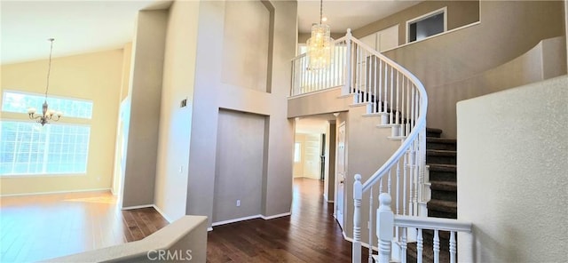 31864 Corte Montecito, Temecula, CA 92592 - foyer featuring a chandelier, hardwood / wood-style floors, a towering ceiling, and stairs
