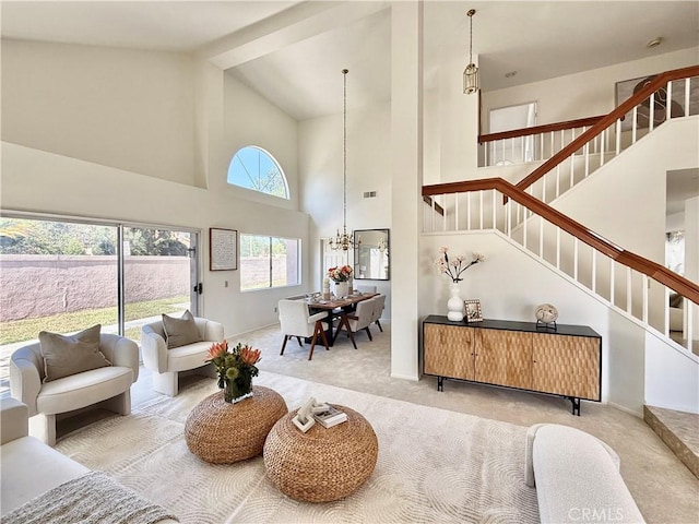 18 Decente, Irvine, CA 92614 - living area with high vaulted ceiling, stairway, carpet, and a chandelier