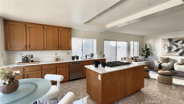 18 Decente, Irvine, CA 92614 - kitchen featuring stainless steel appliances, light countertops, brown cabinetry, open floor plan, and a kitchen island