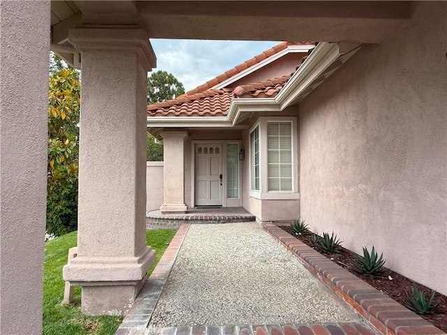 18 Decente, Irvine, CA 92614 - view of exterior entry with stucco siding and a tiled roof