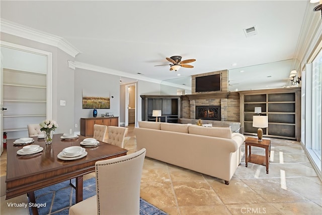29 Hemingway Ct, Trabuco Canyon, CA 92679 - living area with a ceiling fan, crown molding, built in shelves, and a large fireplace