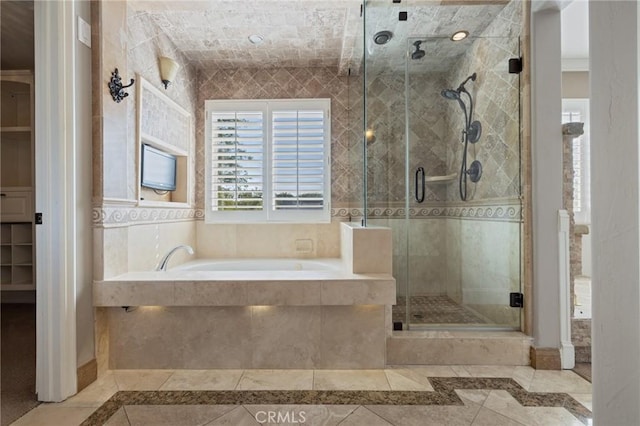 29 Hemingway Ct, Trabuco Canyon, CA 92679 - bathroom featuring inlaid floor details, a garden tub, a stall shower, and a walk in closet