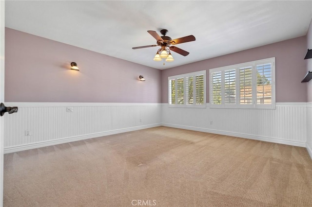 29 Hemingway Ct, Trabuco Canyon, CA 92679 - carpeted spare room with a ceiling fan and wainscoting