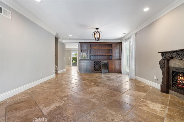 29 Hemingway Ct, Trabuco Canyon, CA 92679 - unfurnished living room with ornamental molding, stone tile flooring, recessed lighting, and a lit fireplace