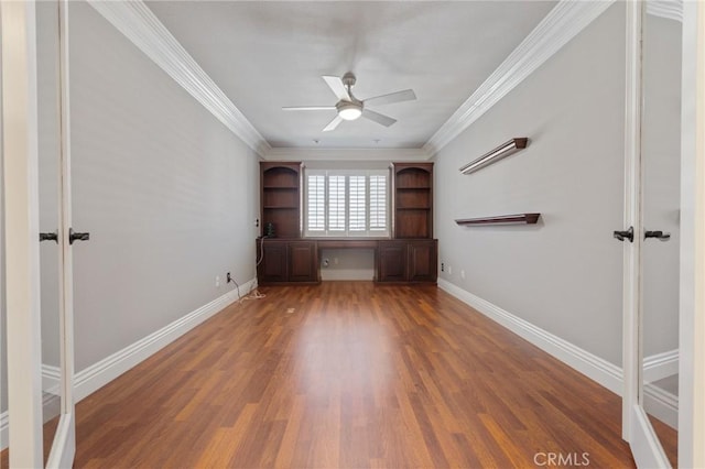 29 Hemingway Ct, Trabuco Canyon, CA 92679 - unfurnished bedroom featuring wood finished floors, built in study area, ornamental molding, and ceiling fan