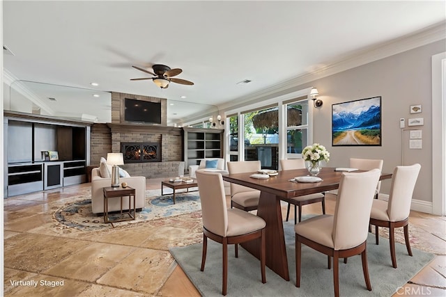 29 Hemingway Ct, Trabuco Canyon, CA 92679 - dining room featuring crown molding, ceiling fan, stone tile floors, a fireplace, and recessed lighting