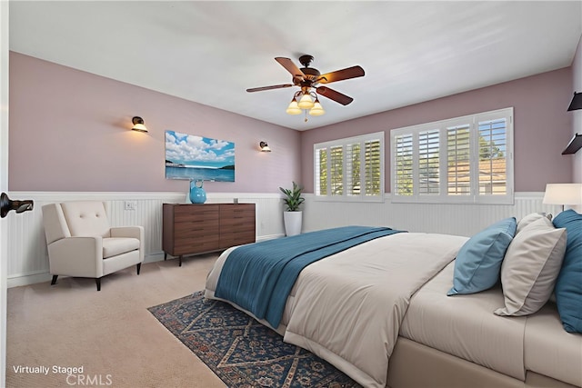 29 Hemingway Ct, Trabuco Canyon, CA 92679 - bedroom with a wainscoted wall, multiple windows, light carpet, and ceiling fan