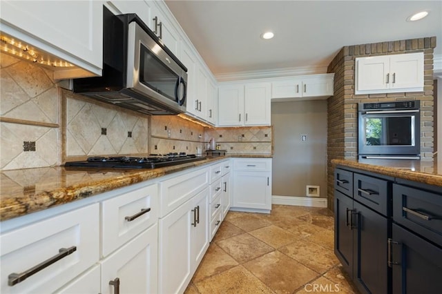29 Hemingway Ct, Trabuco Canyon, CA 92679 - kitchen with dark stone counters, white cabinets, black gas stovetop, backsplash, and recessed lighting