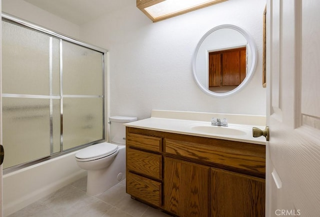 43920 Delgado Ct, Lancaster, CA 93535 - bathroom with vanity, enclosed tub / shower combo, and tile patterned flooring
