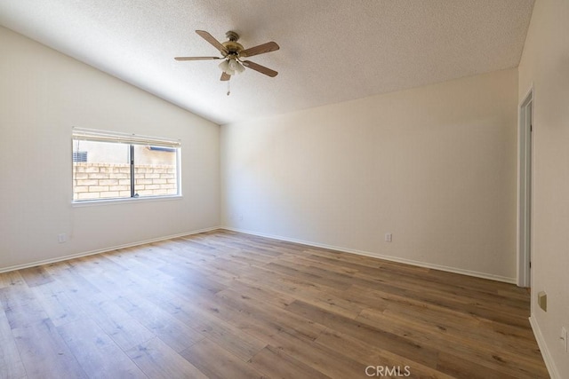 43920 Delgado Ct, Lancaster, CA 93535 - unfurnished room featuring ceiling fan, a textured ceiling, wood finished floors, and vaulted ceiling