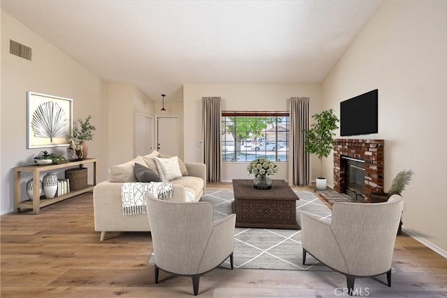 43920 Delgado Ct, Lancaster, CA 93535 - living room featuring lofted ceiling, light wood-type flooring, and a fireplace