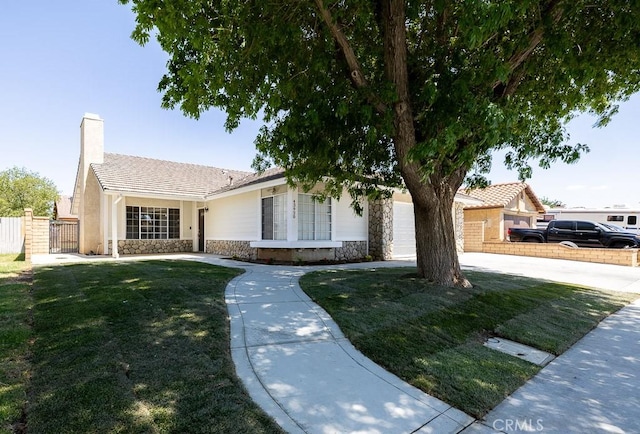 43920 Delgado Ct, Lancaster, CA 93535 - single story home with stone siding and a chimney