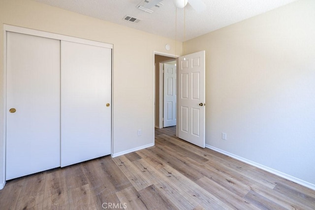 43920 Delgado Ct, Lancaster, CA 93535 - unfurnished bedroom with wood finished floors, a closet, and a ceiling fan