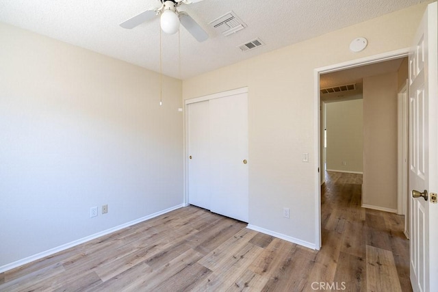 43920 Delgado Ct, Lancaster, CA 93535 - unfurnished bedroom with wood finished floors, a closet, and ceiling fan
