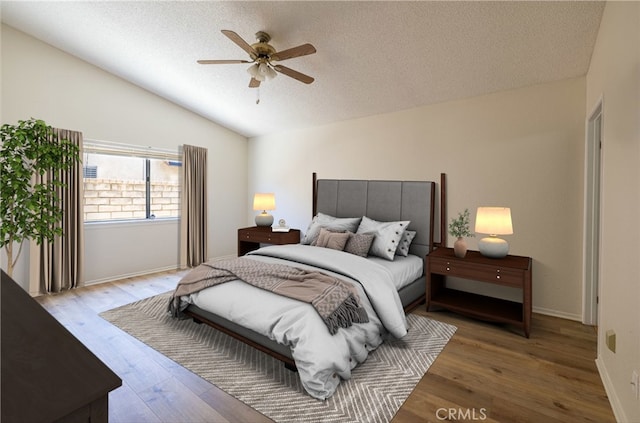 43920 Delgado Ct, Lancaster, CA 93535 - bedroom with lofted ceiling, wood finished floors, a textured ceiling, and ceiling fan