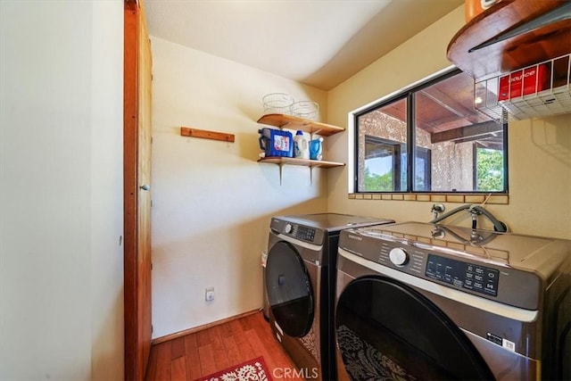 7575 Whitney Ave, Yucca Valley, CA 92284 - washroom with washing machine and clothes dryer and wood finished floors