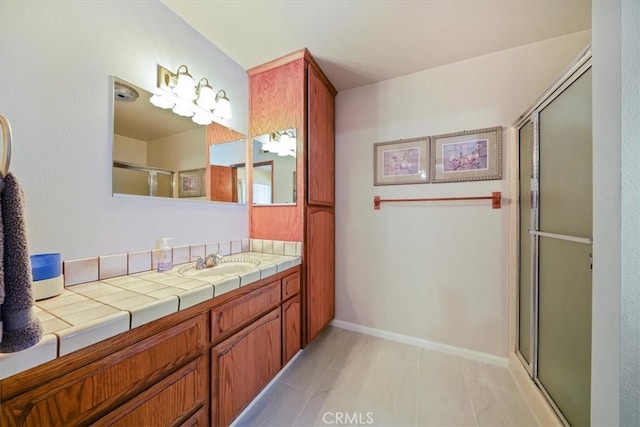7575 Whitney Ave, Yucca Valley, CA 92284 - bathroom with vanity, a shower with door, and tile patterned floors
