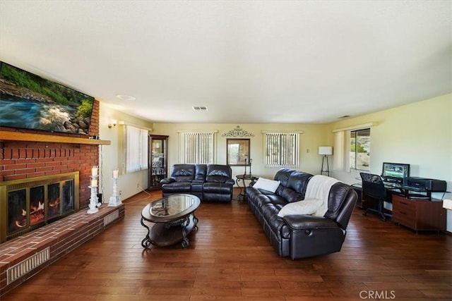 7575 Whitney Ave, Yucca Valley, CA 92284 - living room with plenty of natural light, wood finished floors, and a fireplace