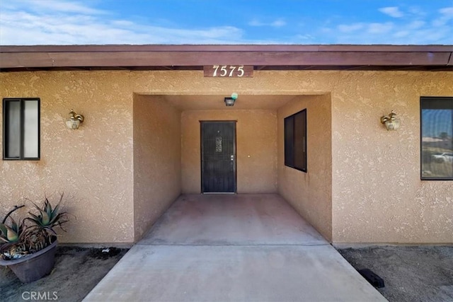 7575 Whitney Ave, Yucca Valley, CA 92284 - entrance to property with stucco siding