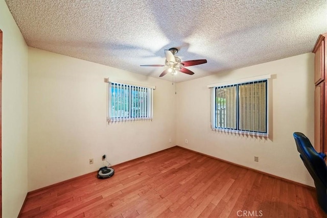 7575 Whitney Ave, Yucca Valley, CA 92284 - unfurnished room featuring ceiling fan, light wood-type flooring, and a textured ceiling