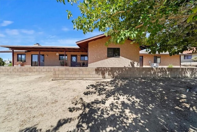 7575 Whitney Ave, Yucca Valley, CA 92284 - back of house featuring stucco siding