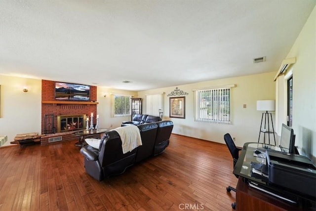 7575 Whitney Ave, Yucca Valley, CA 92284 - living area with hardwood / wood-style floors and a fireplace