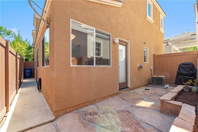 18 Rue Brittany, Lake Forest, CA 92610 - rear view of property featuring stucco siding, a patio, and a fenced backyard