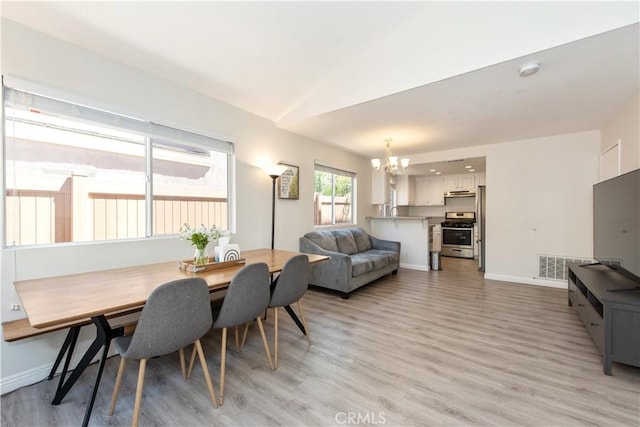 18 Rue Brittany, Lake Forest, CA 92610 - dining area featuring a chandelier and light wood-style flooring