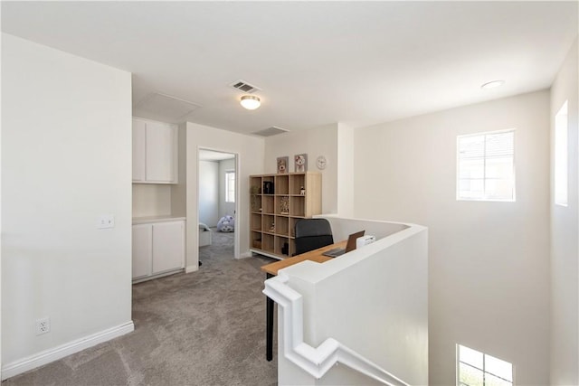 18 Rue Brittany, Lake Forest, CA 92610 - hallway featuring light colored carpet, healthy amount of natural light, and an upstairs landing