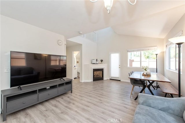 18 Rue Brittany, Lake Forest, CA 92610 - living room with wood finished floors, a glass covered fireplace, and lofted ceiling